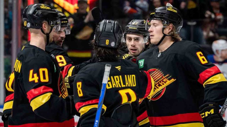 Vancouver Canucks' Quinn Hughes (43) celebrates his goal against the Edmonton Oilers with Elias Pettersson (40), J.T. Miller (9), Conor Garland (8), and Brock Boeser (6) during the first period of an NHL hockey game in Vancouver, on Saturday, Jan. 18, 2025. (Ethan Cairns/CP)