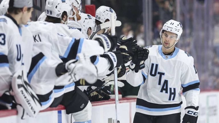 Utah Hockey Club right wing Dylan Guenther (11) is congratulated for his goal against the Minnesota Wild during the first period of an NHL hockey game. (Matt Krohn/AP)
