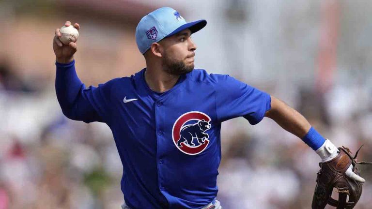 Chicago Cubs third baseman Nick Madrigal throws to first base to get San Francisco Giants' Patrick Bailey out during the second inning of a spring training baseball game Saturday, Feb. 24, 2024, in Scottsdale, Ariz. (Ross D. Franklin/AP)