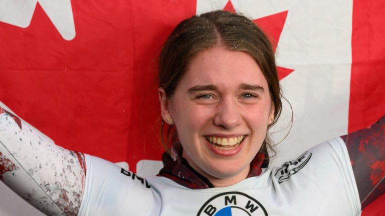 Hallie Clarke from Canada celebrates her victory during the Skeleton World Championship, women's singles, 4th run in Winterberg, Germany, Friday Feb. 23, 2024. (Robert Michael/dpa via AP)