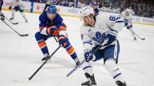 Toronto Maple Leafs' William Nylander (88) drives past New York Islanders' Noah Dobson (8) during the first period of an NHL hockey game, Thursday, Jan. 2, 2025, in Elmont, N.Y. (Frank Franklin II/AP)