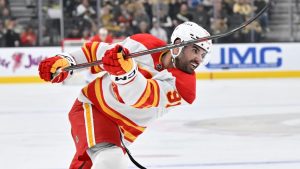 Calgary Flames centre Nazem Kadri (91) follows through with a shot against the Vegas Golden Knights during the first period of an NHL hockey game Sunday, Dec. 29, 2024, in Las Vegas. (David Becker/AP)