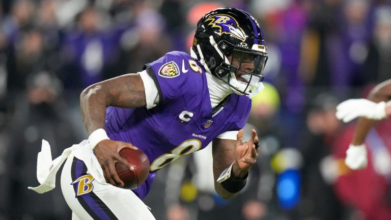 Baltimore Ravens quarterback Lamar Jackson runs with the ball against the Pittsburgh Steelers during the first half of an NFL wild-card playoff football game, Saturday, Jan. 11, 2025, in Baltimore. (Stephanie Scarbrough/AP Photo)