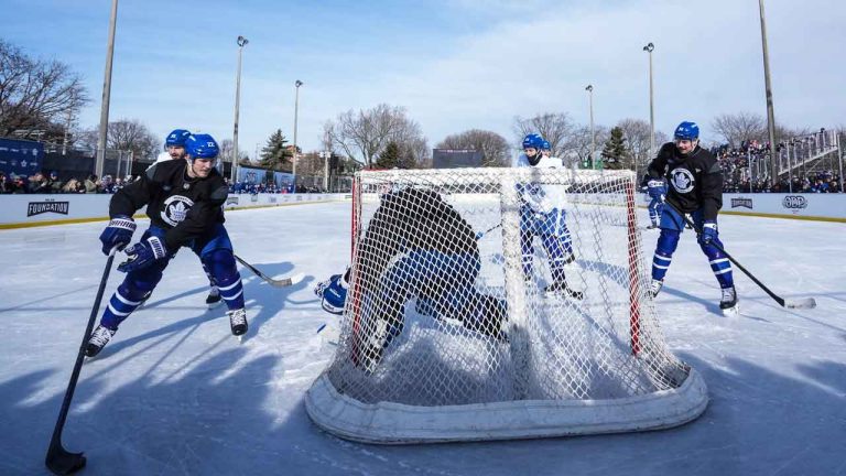 Toronto Maple Leafs players including Jake McCabe (left) and Auston Matthews (right) take part in an outdoor practice at Toronto's Prince of Wales rink. (Chris Young/THE CANADIAN PRESS)