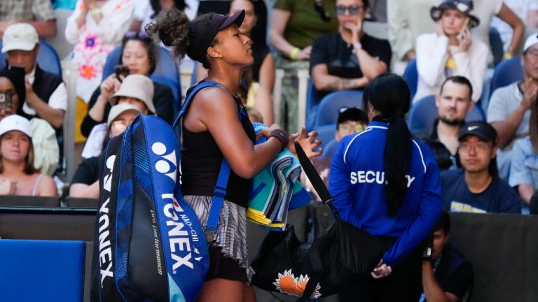 Naomi Osaka of Japan leaves the court after retiring from her third round match against Belinda Bencic of Switzerland at the Australian Open tennis championship in Melbourne, Australia, Friday, Jan. 17, 2025. (Manish Swarup/AP)