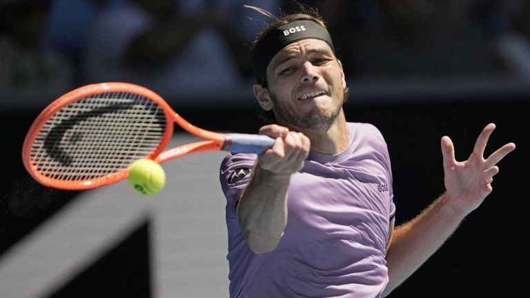 Taylor Fritz of the U.S. plays a forehand return to Cristian Garin of Chile during their second round match at the Australian Open tennis championship in Melbourne. (Ng Han Guan/AP)