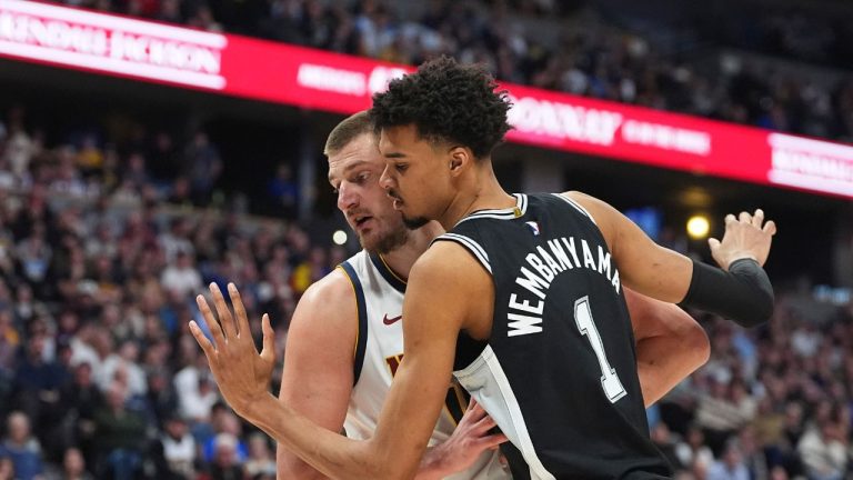 San Antonio Spurs centre Victor Wembanyama (1) and Denver Nuggets centre Nikola Jokic (15) in the second half of an NBA basketball game Friday, Jan. 3, 2025, in Denver. (David Zalubowski/AP)