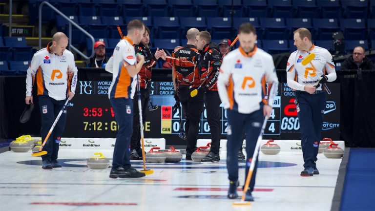 Team Whyte (background) celebrate after defeating Team Gushue 9-4 in the WFG Masters on Jan. 16, 2025, in Guelph, Ont. (Anil Mungal/GSOC)