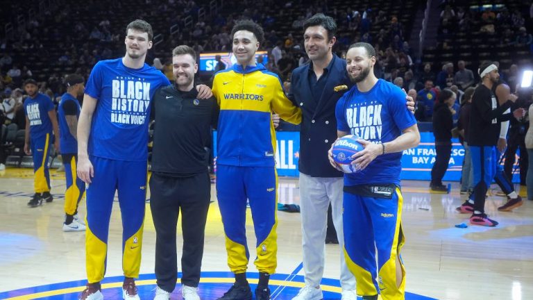 Golden State Warriors center Quinten Post, from left, stands with guard Pat Spencer , forward Trayce Jackson-Davis, Warriors liason of basketball and business Zaza Pachulia, and guard Stephen Curry during a presentation of a Money Ball for the 2025 NBA All-Star weekend before an NBA basketball game. (Jeff Chiu/AP)