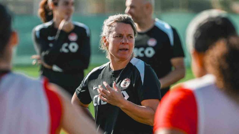 Canada under-20 head coach Cindy Tye speaks with players during a soccer training session in this undated handout image. THE CANADIAN PRESS/HO-Canada Soccer