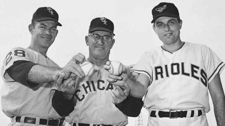 Manager Al Lopez of the Chicago White Sox, center, stands with Chicago pitcher Eddie Fisher, left, and Baltimore Orioles' Milt Pappas on July 11, 1965 in Baltimore. (AP Photo/File)