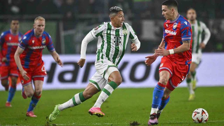 Ferencvaros' Matheus Saldanha challenges for the ball with Plzen's Svetozar Markovic during a Europa League playoff first leg soccer match between Ferencvaros and Viktoria Plzen at the Groupama Arena stadium, in Budapest, Hungary, Thursday, Feb. 13, 2025. (Denes Erdos/AP)