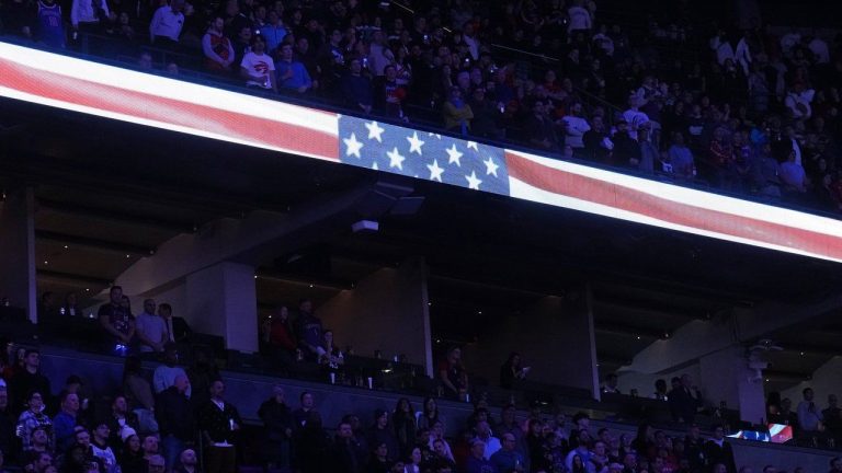 Fans stand for the U.S. national anthem prior to first half NBA basketball action between the Toronto Raptors and the New York Knicks in Toronto on Tuesday, February 4, 2025. (Nathan Denette/CP)