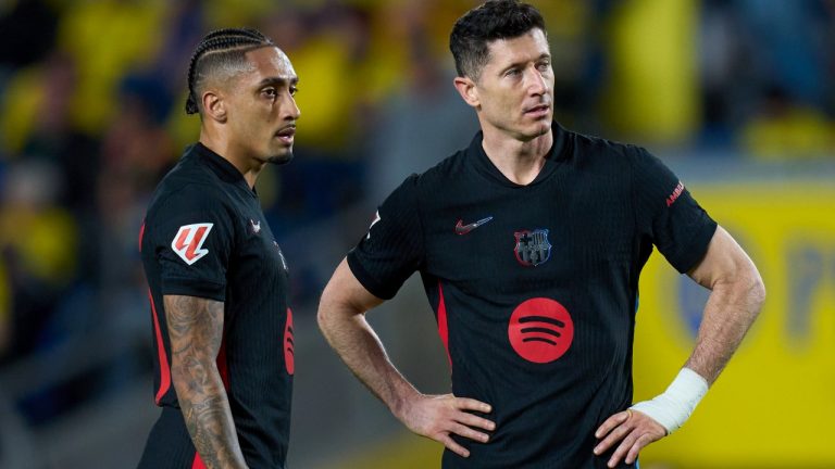 Barcelona's Robert Lewandowski, right, and Barcelona's Raphinha prepare for a free kick during the Spanish La Liga soccer match between Las Palmas and Barcelona at the Gran Canaria stadium in Las Palmas, Spain's Canary Islands, Saturday, Feb. 22, 2024. (AP Photo/Gabriel Jimenez)