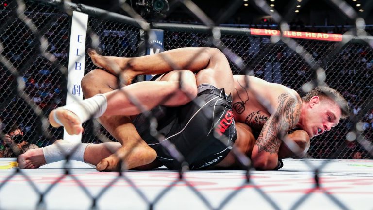 Brendan Allen, top, looks for a submission hold on Karl Roberson during a UFC 261 mixed martial arts bout, Saturday, April 24, 2021, in Jacksonville, Fla. It is the first UFC event since the onset of the COVID-19 pandemic to feature a full crowd in attendance. (AP Photo/Gary McCullough)