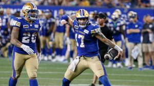Winnipeg Blue Bombers quarterback Chris Streveler celebrates his run for the first down against the Ottawa Redblacks during CFL action in Winnipeg Friday, July 5, 2024. (John Woods/CP)