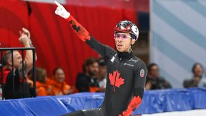 William Dandjinou from Canada reacts after leading his team to victory over Italy, the Netherlands and China in the final of the mens 5000-metre relay race at the the ISU World Tour Short Track Speedskating event in Montreal, Sunday, October 27, 2024. (Graham Hughes/CP)