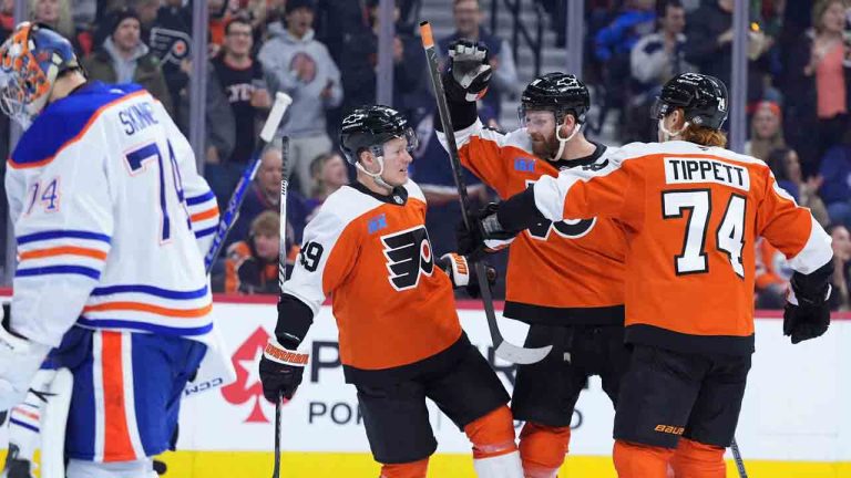 Philadelphia Flyers' Owen Tippett, from right, Sean Couturier and Matvei Michkov celebrate after a goal by Couturier against Edmonton Oilers' Stuart Skinner, left, during the second period of an NHL hockey game, Saturday, Feb. 22, 2025, in Philadelphia. (Matt Slocum/AP)