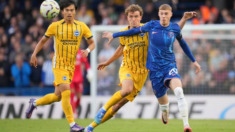 From left, Brighton's Kaoru Mitoma, Brighton's Mats Wieffer and Chelsea's Cole Palmer eye the ball during a Premier League soccer match. (Kin Cheung/AP)