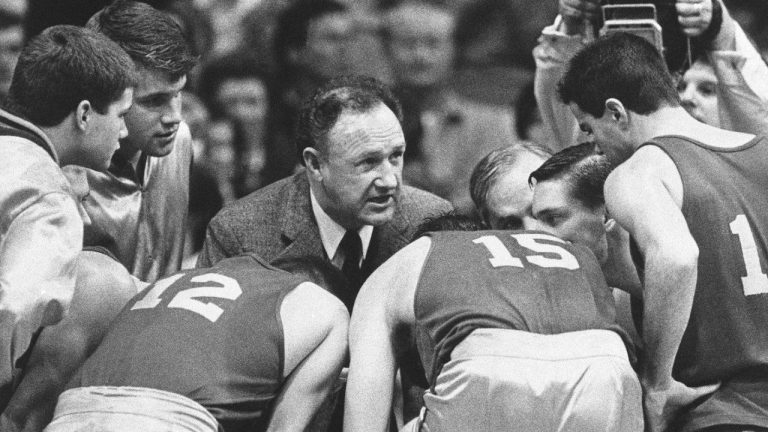 Actor Gene Hackman gives fictional Hickory High basketball players instructions during filming of the final game of the movie "Hoosiers" at Hinkle Fieldhouse on the Butler University campus, Friday, Dec. 6, 1985 in Indianapolis. (Tom Strickland/AP)

