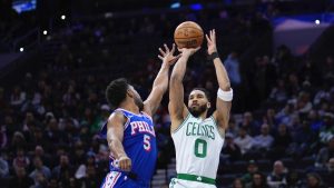 Boston Celtics' Jayson Tatum goes up for a shot against Philadelphia 76ers' Quentin Grimes during the first half of an NBA game, Thursday, Feb. 20, 2025, in Philadelphia. (AP/Matt Slocum)