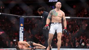 Featherweight fighter Josh Emmett walks away from Bryce Mitchell after a first-round knockout during the UFC 296 mixed martial arts event. (Steve Marcus/AP)