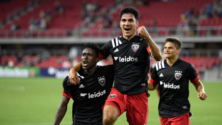D.C. United's Massimo Ferrin, center right, celebrates his goal with Kairou Amoustapha, left, during the second half of a friendly soccer game. (Nick Wass/AP)