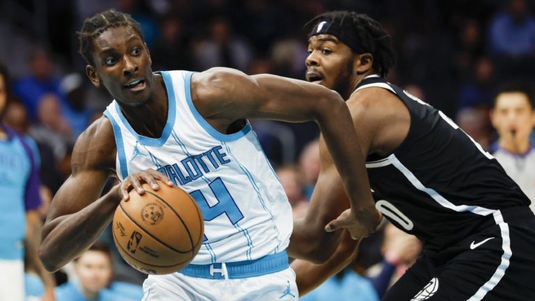 Charlotte Hornets forward Moussa Diabate, left, drives past Brooklyn Nets centre Day'Ron Sharpe during the first half of an NBA game in Charlotte, N.C., Wednesday, Jan. 29, 2025. (AP/Nell Redmond)