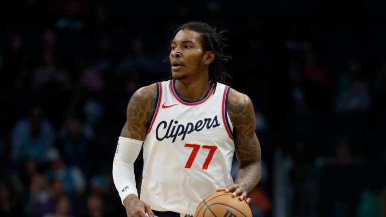 Los Angeles Clippers guard Kevin Porter Jr. brings the ball upcourt against the Charlotte Hornets during the first half of an NBA basketball game in Charlotte, N.C., Friday, Jan. 31, 2025. (AP Photo/Nell Redmond)