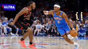 Oklahoma City Thunder guard Shai Gilgeous-Alexander (2) drives against Toronto Raptors guard Immanuel Quickley, left, during the first half of an NBA basketball game Friday, Feb. 7, 2025, in Oklahoma City. (Nate Billings/AP)