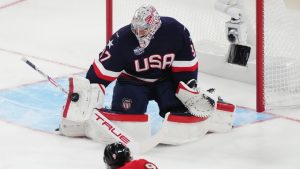United States goaltender Connor Hellebuyck (37) stops a shot from Canada's Sam Bennett (9) during second period 4 Nations Face-Off hockey action in Montreal on Saturday, Feb. 15, 2025. (Christinne Muschi/CP)