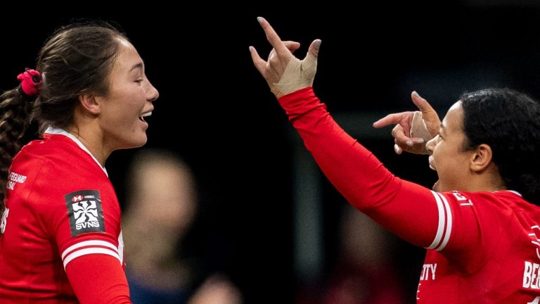 Canada's Florence Symonds and Canada's Fancy Bermudez celebrate after defeating the United States to place seventh overall in the tournament during Vancouver Sevens women's rugby action, in Vancouver, B.C., Sunday, Feb. 23, 2025. (Ethan Cairns/CP)