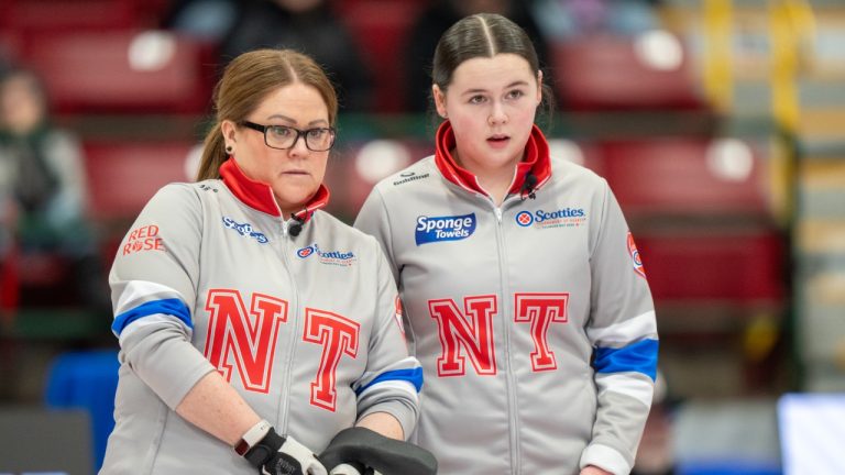 Northwest Territories Kerry Galusha and her daughter vice-skip Sydney Galusha call a shot in Scotties Tournament of Hearts curling action against Manitoba's Kate Cameron in Thunder Bay, Ont. on Saturday, February 15, 2025. (Frank Gunn/CP)