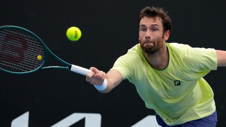 Quentin Halys of France plays a forehand return to compatriot Arthur Fils during their second round match at the Australian Open tennis championship in Melbourne, Australia, Wednesday, Jan. 15, 2025. (Manish Swarup/AP)