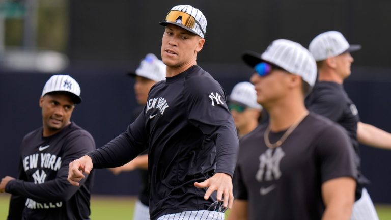 New York Yankees outfielder Aaron Judge, center, stretches during a spring training baseball workout Thursday, Feb. 20, 2025, in Tampa, Fla. (Chris O'Meara/AP)
