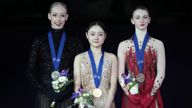 Gold medalist Kim Chae-yeon of South Korea, center, poses with silver medalist Bradie Tennell of the U.S, left, and bronze medalist Sarah Everhardt of the U.S. during the medal ceremony for the women's single competition of the ISU Four Continents Figure Skating Championships at the Mokdong ice rink in Seoul, South Korea, Sunday, Feb. 23, 2025. (Lee Jin-man/AP)