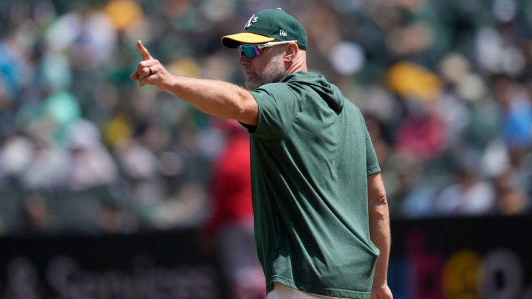 Oakland Athletics manager Mark Kotsay signals to the bullpen to make a pitching change during the sixth inning of a baseball game against the Los Angeles Angels in Oakland, Calif., Sunday, July 21, 2024. (Jeff Chiu/AP)
