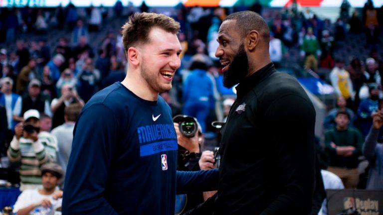 Dallas Mavericks guard Luka Doncic shares a laugh with Los Angeles Lakers forward LeBron James following an NBA basketball game in Dallas, Sunday, Dec. 25, 2022. Dallas won the game by a final of 124-115. (Emil T. Lippe/AP Photo)