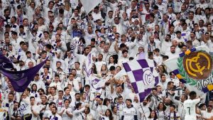 Real Madrid's fans support their team during the Spanish La Liga soccer match between Real Madrid and Girona at the Santiago Bernabeu stadium in Madrid, Spain, Sunday, Feb. 23, 2025. (Manu Fernandez/AP)