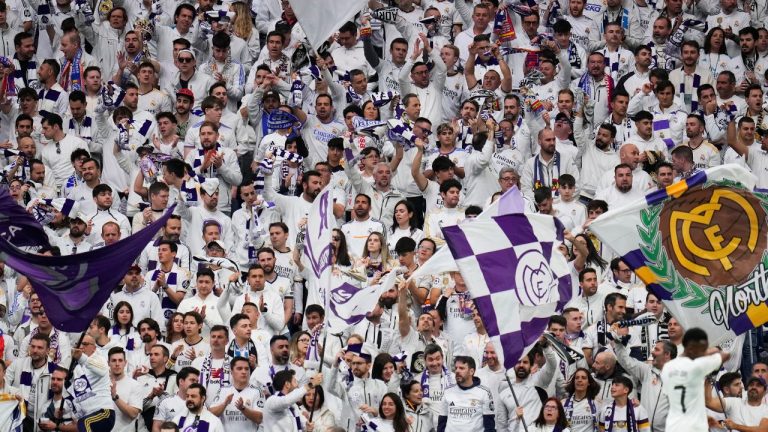 Real Madrid's fans support their team during the Spanish La Liga soccer match between Real Madrid and Girona at the Santiago Bernabeu stadium in Madrid, Spain, Sunday, Feb. 23, 2025. (Manu Fernandez/AP)
