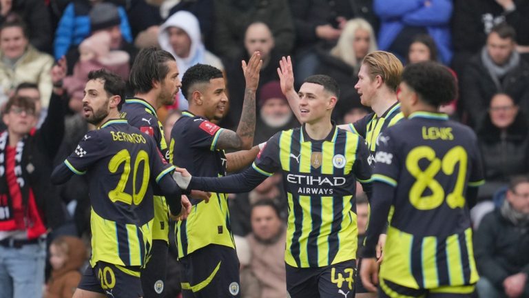 Manchester City players celebrate after Manchester City's Kevin De Bruyne, second right, scored his side's second goal during the English FA Cup fourth round soccer match between Leyton Orient and Manchester City at the Gaughan Group Stadium in London, England, Saturday, Feb. 8, 2025. (Kin Cheung/AP)