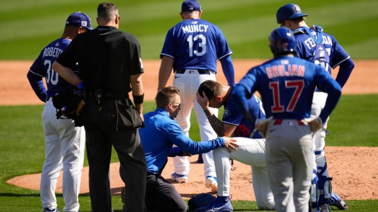 Los Angeles Dodgers pitcher Bobby Miller reacts after being hit by a line drive from Chicago Cubs' Michael Busch during the third inning of a spring training baseball game, Thursday, Feb. 20, 2025, in Phoenix. (Ashley Landis/AP)