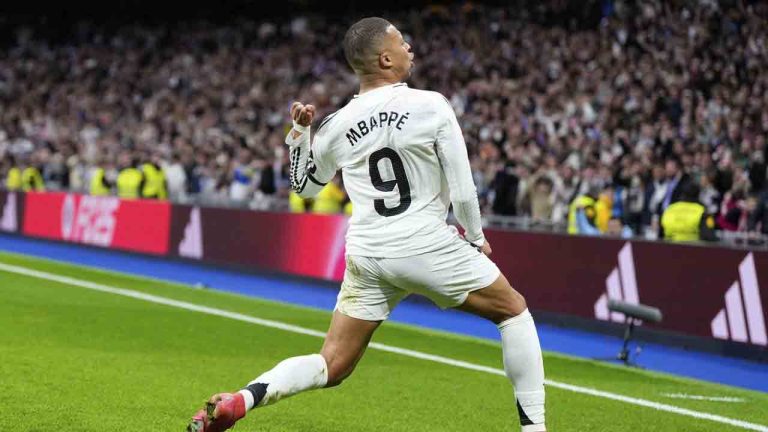 Real Madrid's Kylian Mbappe celebrates after scoring his side's opening goal during the Spanish La Liga soccer match between Real Madrid and Rayo Vallecano at the Santiago Bernabeu stadium in Madrid, Spain, Sunday, March 9, 2025. (Manu Fernandez/AP)