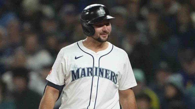 Seattle Mariners' Cal Raleigh greets Athletics catcher Shea Langeliers as he comes up to bat during the first inning of an opening-day baseball game, Thursday, March 27, 2025, in Seattle. (Lindsey Wasson/AP)