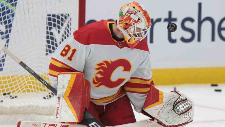 Calgary Flames goalie Connor Murphy warms up before a preseason NHL hockey game against the Seattle Kraken, Monday, Sept. 25, 2023, in Seattle. (Jason Redmond/AP)