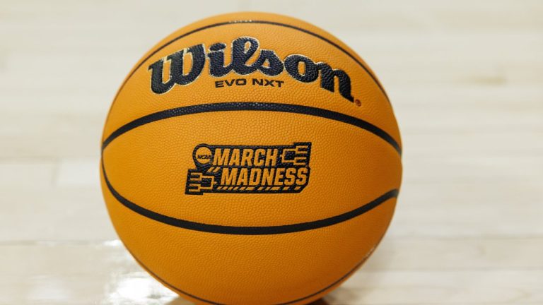 A basketball with a March Madness logo on the court prior to a first-round college basketball game in the NCAA Tournament between Iowa State and Michigan, Friday, March 21, 2025, in South Bend, Ind. (AP Photo/John Mersits)