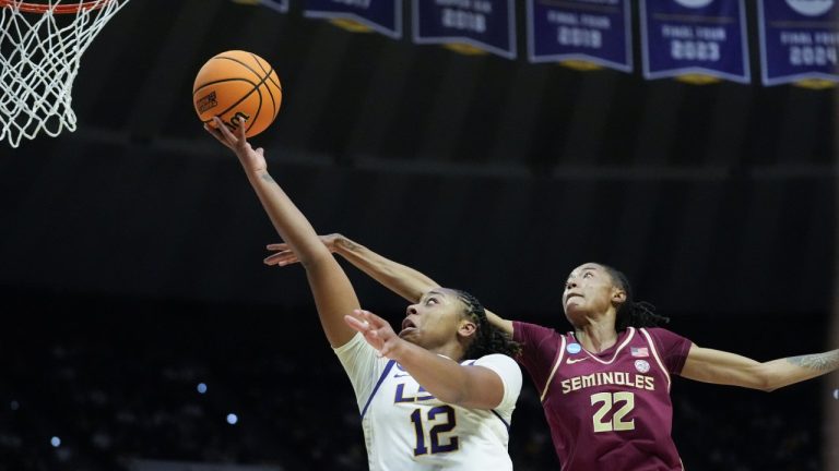 LSU guard Mikaylah Williams (12) goes to the basket against Florida State forward Malea Williams (22) during the first half in the second round of the NCAA college basketball tournament Thursday, March 24, 2025, in Baton Rouge, La. (AP Photo/Gerald Herbert)