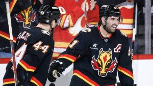 Calgary Flames' Nazem Kadri, right, celebrates his goal with Joel Hanley during second period NHL action against the Dallas Stars. (Jeff McIntosh/CP)