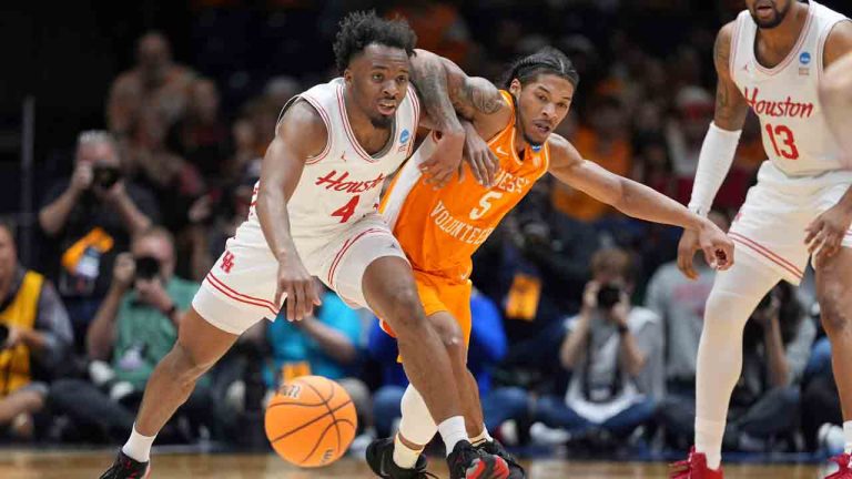Houston's L.J. Cryer (4) and Tennessee's Zakai Zeigler (5) battle for the ball during the second half in the Elite Eight round of the NCAA college basketball tournament Sunday, March 30, 2025, in Indianapolis. (Michael Conroy/AP)