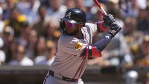 Atlanta Braves left fielder Jurickson Profar batting during the first inning of an opening-day baseball game against the San Diego Padres. (Gregory Bull/AP)
